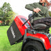 Man operating the Cobra grass box emptying handle on a Cobra premium lawn tractor 