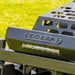 Close-up of a Cobra ZTS32L bumper with 'COBRA' branding on a grassy background
