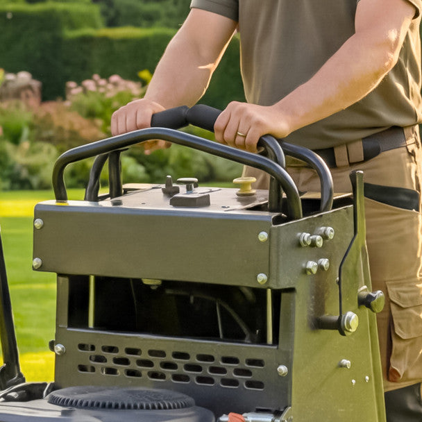Person holding a Cobra ZTS32L in a garden setting