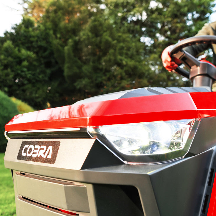 Close up of a Cobra premium ride on lawn mower front headlights