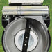 Close-up of the underside of a cobra rm533hst cutting deck on a grassy background 