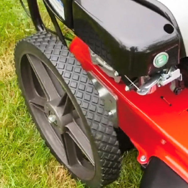 Close-up of a Cobra WT56B Wheeled trimmer on grass