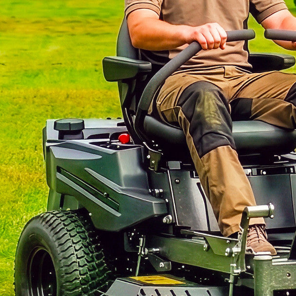 Close up of Person operating a cobra ztr42l zero turn  lawn mower on grass