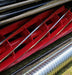 Image of 10 blade Red on a grassy surface