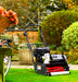 Wide shot image of a Cobra Fortis 17b on a finely cut lawn with bushes in the background