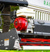 Close-up of a Cobra  Fortis Stadium honda GX engine on grass.