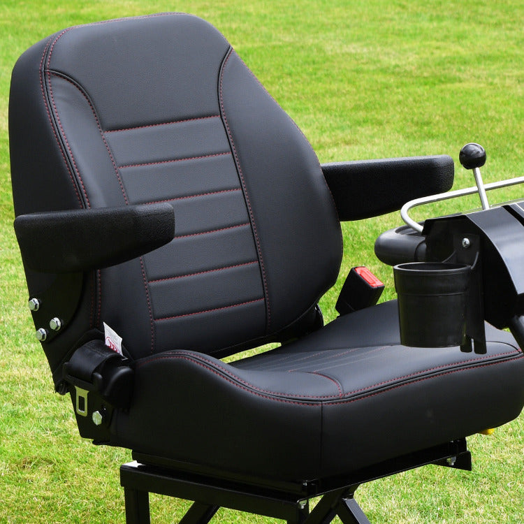 Image of Cobra Fortis trailed seat. Black seat with armrests on a green grass background