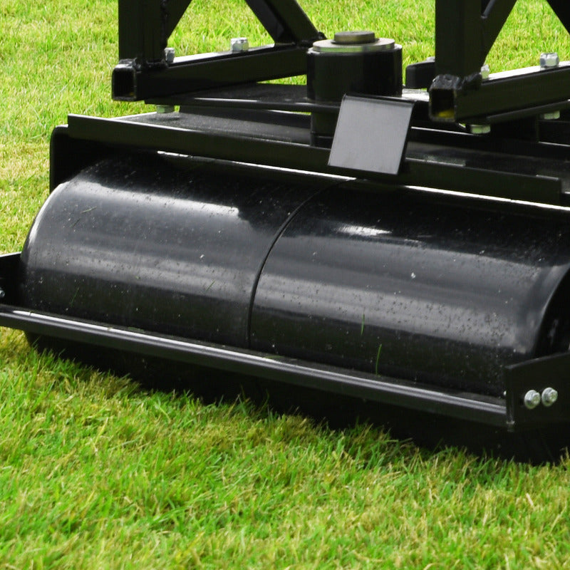 Image of Cobra Fortis trailed seat. Close-up of a rear roller. Image against a lawn background.