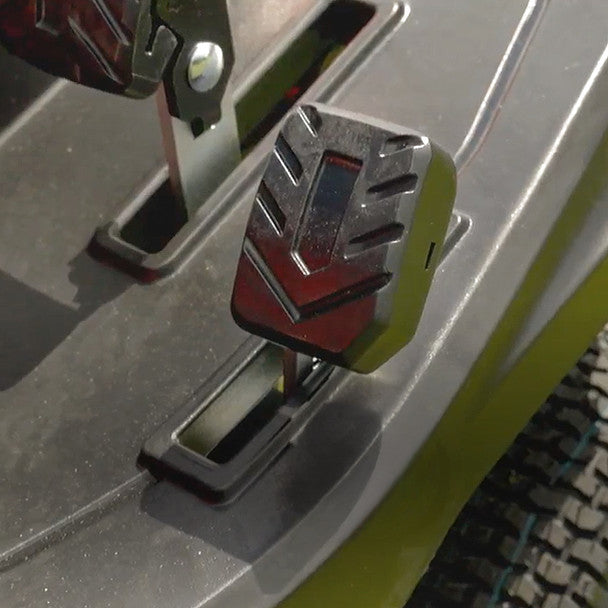 Close-up of a cobra ride on mower  and presser foot on a gray background
