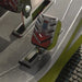 Close-up of a cobra ride on mower  and presser foot on a gray background