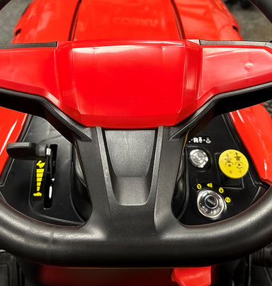 Close-up of a rCobra ride on lawn tractor control panel.