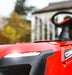 Close-up of a Cobra ride on lawn mower ultra bright LED lights with a blurred background