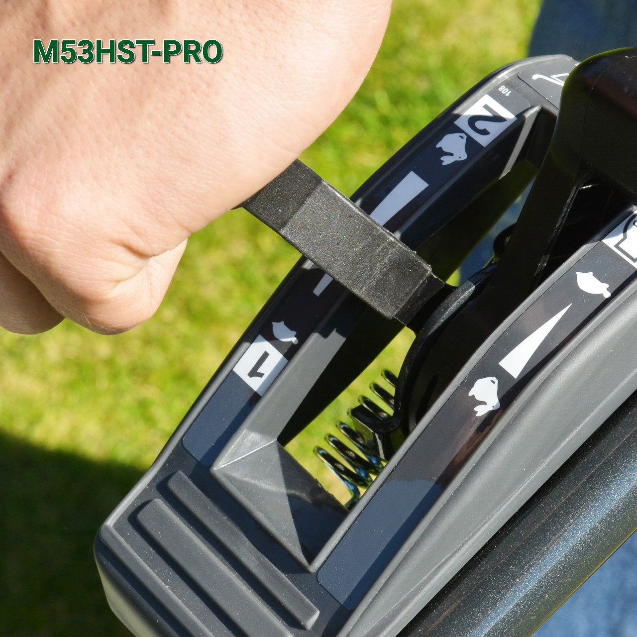 Close up of  Cobra M53HST throttle control against grass