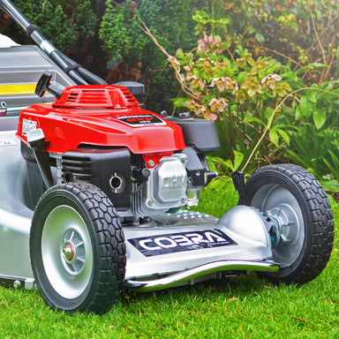 Cobra M53SPH_PRO push lawnmower, mid close up of front bar. Set in a garden 